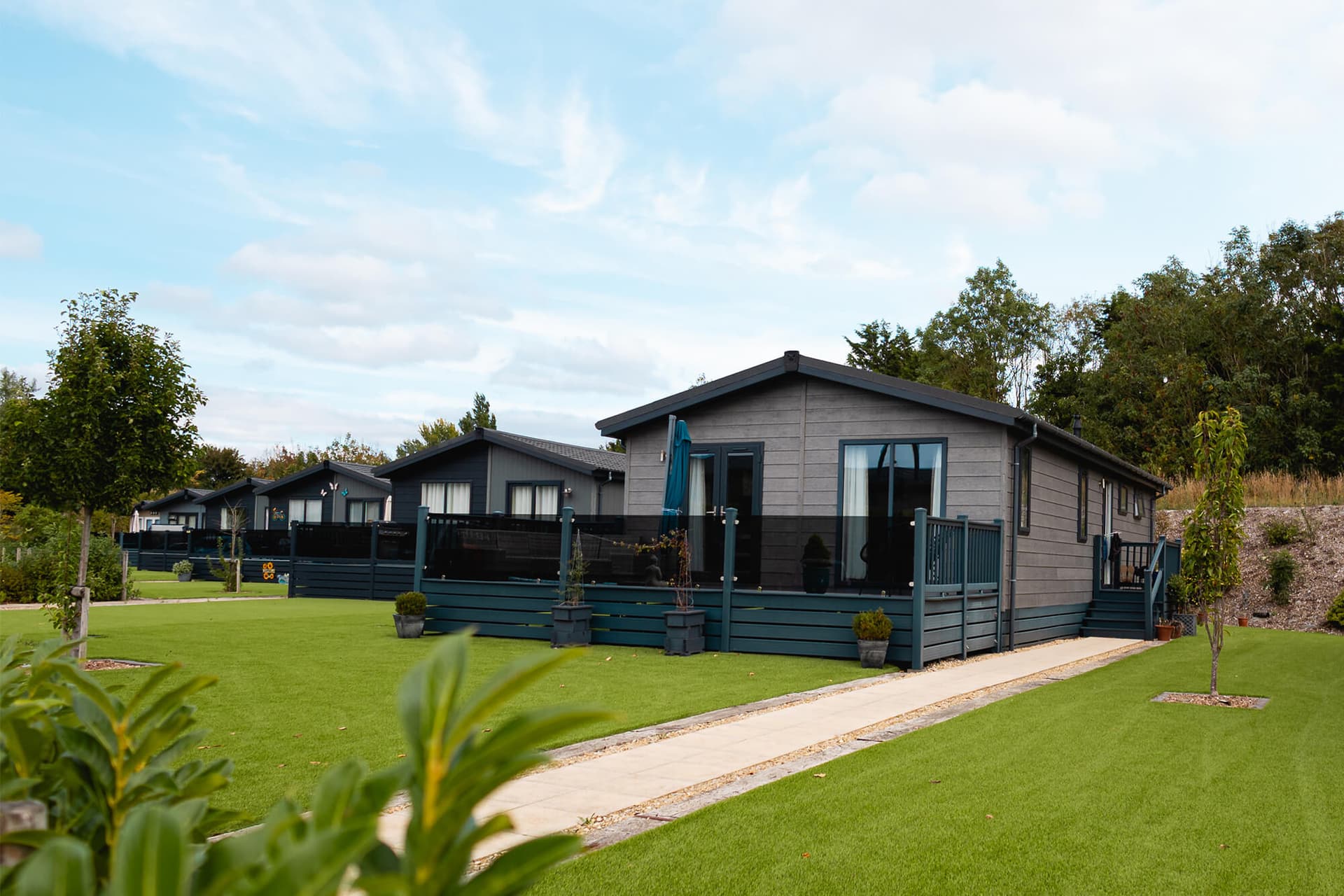 Image showing a row of holiday homes on a green